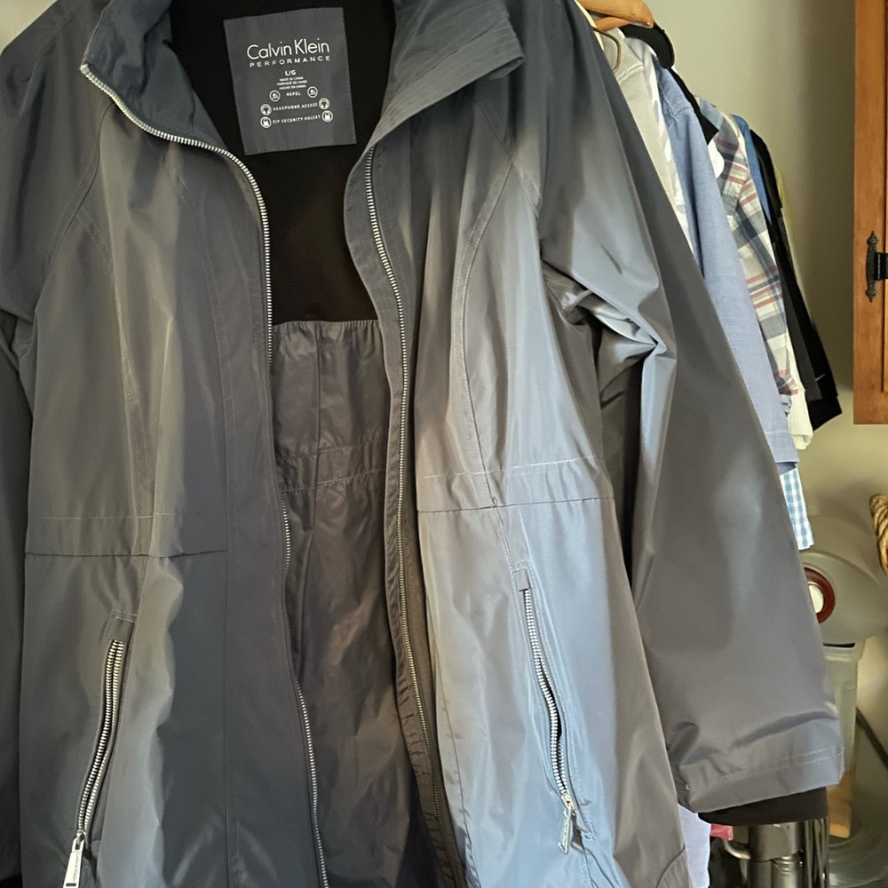 Calvin Klein rain jacket coat; Performance headset access. Zip security